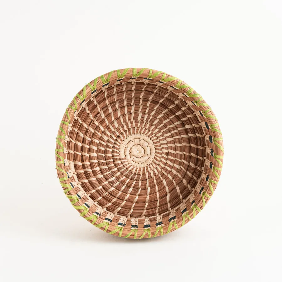 Basket made of pine needle and raffia