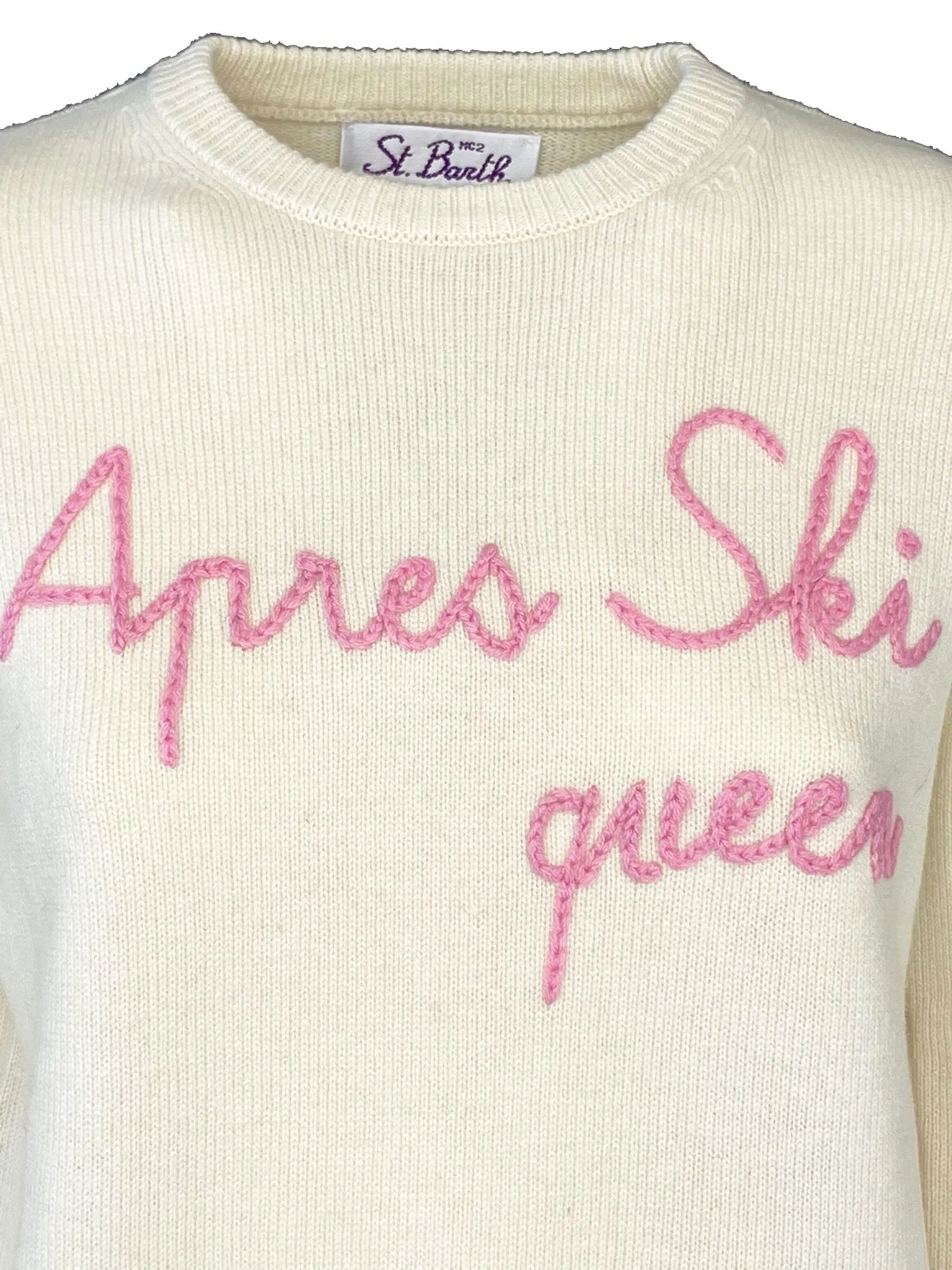 White embroidered après ski queen pullover.