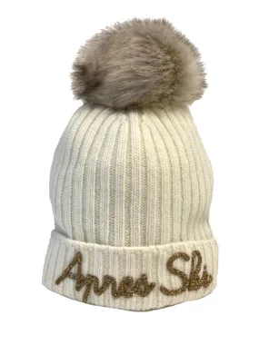 White embroidered women's ski beanies with pom poms.