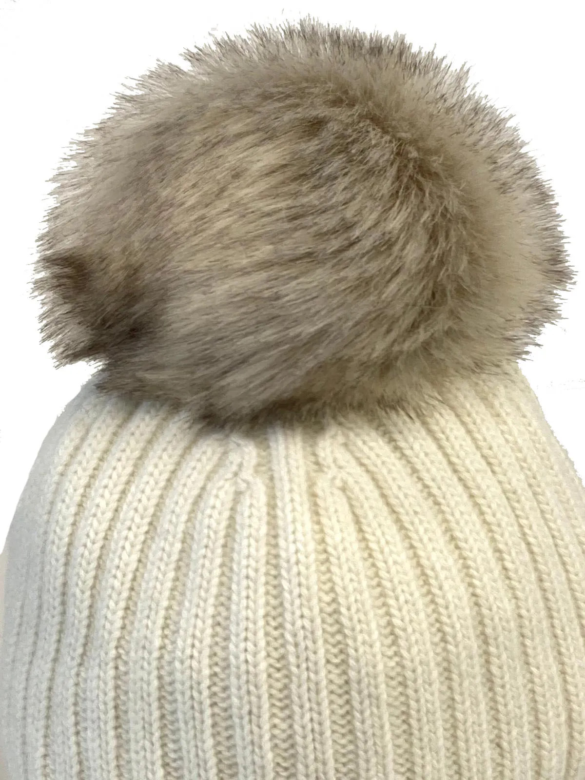 White embroidered women's ski beanies with pom poms.